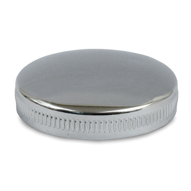 Early bayonet style gas cap, vented right side. Chrome